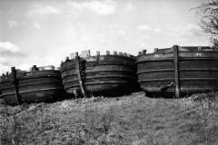 Three barges on dry land