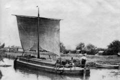 A keel is slowly heading along a section of the Aire & Calder Navigation.