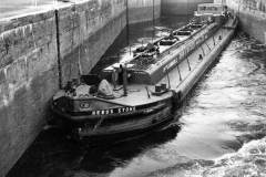 Filling a lock occupied by the tanker barge Rebus Stone. 