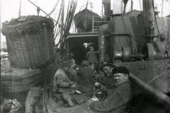 A group of workmen taking their lunch in 1900.