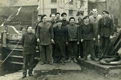 Workers posing for photo.