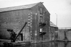 A Huddersfield Broad Canal warehouse and crane.