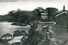 A coal-laden barge having just exiting No 1 Lock, Heath Lock, Wakefield.