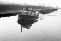 Train of coal laden compartment boats