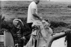 A crewman on the bow of a barge.