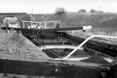 A compartment boat working through Broad Cut Top Lock No 4.