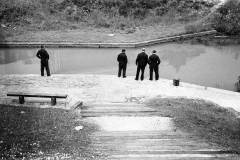 Men observing a canal