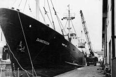 The MV Zaanstroom discharging palletised frozen beans.